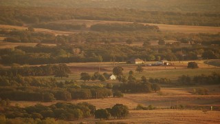 HDA12_065 - HD aerial stock footage video flyby farmhouses and fields at sunrise in Comanche Lake, Oklahoma