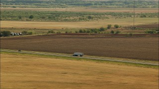 HDA12_091 - HD stock footage aerial video of tracking a truck, Highway 44 near Walters, Oklahoma