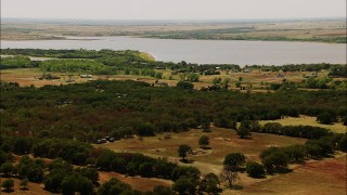 HD stock footage aerial video of fly over farms to approach a lake in Oklahoma Aerial Stock Footage | HDA12_109