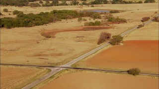 HD stock footage aerial video pass by country road and farmland with cows grazing near pond in Oklahoma Aerial Stock Footage | HDA12_121