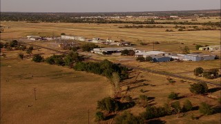 HD stock footage aerial video of flying by a small town with a power station in Meridian, Oklahoma Aerial Stock Footage | HDA12_125