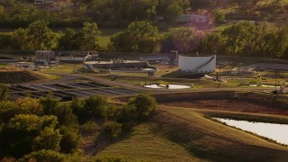 HDA12_126 - HD stock footage aerial video of a water treatment plant at sunset in Duncan, Oklahoma