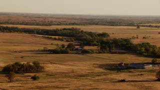 HD stock footage aerial video of a farmhouse and fields at sunset in Oklahoma Aerial Stock Footage | HDA12_129