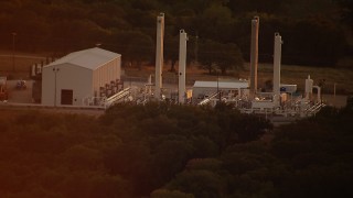 HD stock footage aerial video of an industrial building at sunset in Texas Aerial Stock Footage | HDA12_158