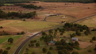 HDA12_169 - HD stock footage aerial video of flying over Highway 380 through Decatur, Texas, sunset