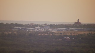 HDA12_170 - HD aerial stock footage video of a factory at sunset in Decatur, Texas