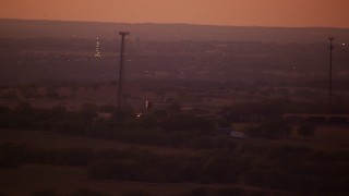 HDA12_182 - HD stock footage aerial video of a train passing through farmland at night in Decatur, Texas