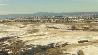 HD stock footage aerial video fly over fields toward suburban homes in Castle Pines, Colorado Aerial Stock Footage | HDA13_276