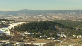 HD stock footage aerial video of flying over homes and a hilltop mansion in Castle Pines, Colorado Aerial Stock Footage | HDA13_279