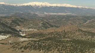 HD stock footage aerial video of hills and snow-capped Rocky Mountains, Colorado Aerial Stock Footage | HDA13_324