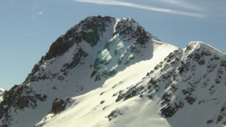 HDA13_357 - HD stock footage aerial video of orbiting a snowy peak in the Rocky Mountains, Colorado