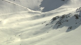 HD stock footage aerial video pan across a slope and fly over ridge in the Rocky Mountains, Colorado Aerial Stock Footage | HDA13_359