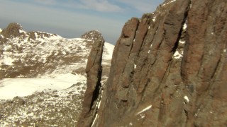 HDA13_376 - HD stock footage aerial video flyby rocky protrusion and over a ridge in the Rocky Mountains, Colorado