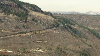 HD stock footage aerial video of zooming to a road on a mountain slope in the Rocky Mountains, Colorado Aerial Stock Footage | HDA13_381