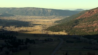 HD stock footage aerial video of following the road toward the town of Ridgway, Colorado at sunset Aerial Stock Footage | HDA13_392_01