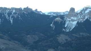 HD stock footage aerial video of flying by snowy Rocky Mountains at sunrise, Colorado Aerial Stock Footage | HDA13_401