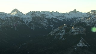 HDA13_404 - HD stock footage aerial video of snowy Rocky Mountains at sunrise, Colorado