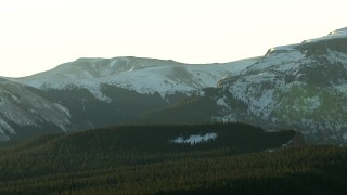 HD stock footage aerial video of flying by snow capped ridges at sunrise in the Rocky Mountains, Colorado Aerial Stock Footage | HDA13_405