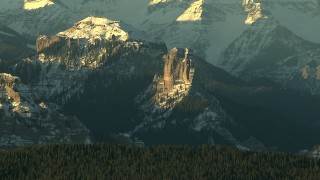 HDA13_409 - HD stock footage aerial video of steep slopes and snow in the Rocky Mountains at sunrise, Colorado