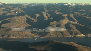 HD stock footage aerial video of flying by the Blue Mesa Reservoir and Rocky Mountains at sunrise, Colorado Aerial Stock Footage | HDA13_416