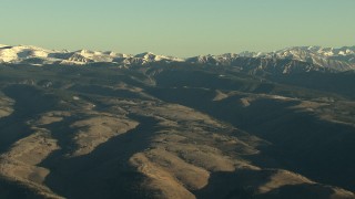 HD stock footage aerial video of rounded and snowy Rocky Mountains at sunrise, Colorado Aerial Stock Footage | HDA13_420