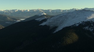 HD stock footage aerial video of panning across a snowy ridge at sunrise, Rocky Mountains, Colorado Aerial Stock Footage | HDA13_440