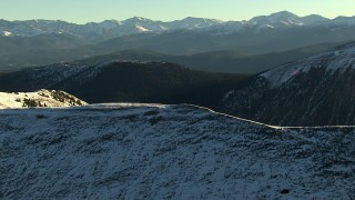 HD stock footage aerial video of flying over a snowy ridge at sunrise, Rocky Mountains, Colorado Aerial Stock Footage | HDA13_440_01