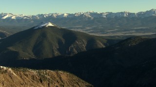 HD stock footage aerial video of panning across the snowy summits at sunrise, Rocky Mountains, Colorado Aerial Stock Footage | HDA13_440_02