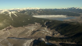 HD stock footage aerial video of a reservoir with fog at sunrise, surrounded by the Rocky Mountains, Colorado Aerial Stock Footage | HDA13_442