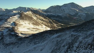 HD stock footage aerial video approach and fly over ridges with snow in the Rocky Mountains at sunrise, Colorado Aerial Stock Footage | HDA13_445