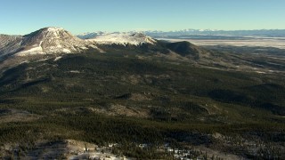 HD stock footage aerial video of snowy mountains and green hills at sunrise in the Rocky Mountains, Colorado Aerial Stock Footage | HDA13_455