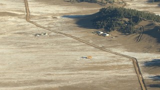 HD stock footage aerial video of farmhouses and fields beside a country road in Park County, Colorado Aerial Stock Footage | HDA13_466