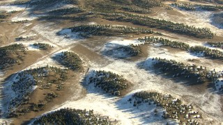 HD stock footage aerial video of flying over rounded hills and patches of snow in Park County, Colorado Aerial Stock Footage | HDA13_468