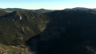 HD stock footage aerial video of flying over a green mountain ridge with snow patches in the Rocky Mountains, Colorado Aerial Stock Footage | HDA13_473