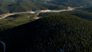 HD stock footage aerial video of flying over evergreen trees on mountains with snow in the Rocky Mountains, Colorado Aerial Stock Footage | HDA13_474