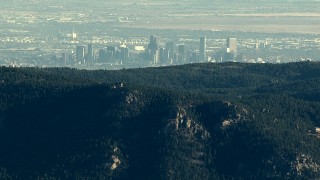 HD stock footage aerial video of the Downtown Denver skyline seen from a ridge in the Rocky Mountains, Colorado Aerial Stock Footage | HDA13_477_01