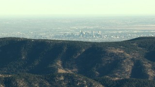 HDA13_480_01 - HD stock footage aerial video of Denver's skyline seen from the Rocky Mountains, Colorado, zoom to wider view