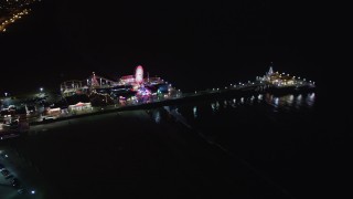 LD01_0032 - 5K aerial stock footage orbit around Santa Monica Pier, California at night