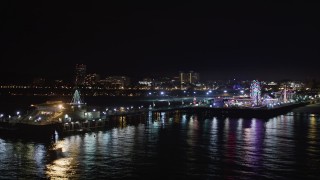 LD01_0034 - 5K aerial stock footage circling around the end of the Santa Monica Pier, California at night