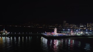 5K aerial stock footage an orbit around the side of Santa Monica Pier, California at night Aerial Stock Footage | LD01_0035