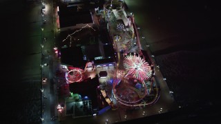 LD01_0042 - 5K aerial stock footage tilt to a bird's eye of the Ferris wheel at Santa Monica Pier, California at night