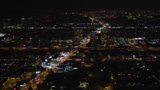 LD01_0043 - 5K aerial stock footage approach office buildings near 405 at night West Los Angeles, California