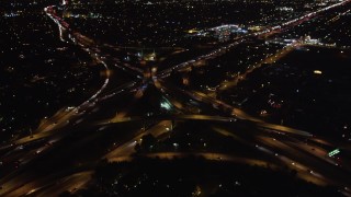 5K aerial stock footage pan across freeway at night to reveal interchange, West Los Angeles, California Aerial Stock Footage | LD01_0044