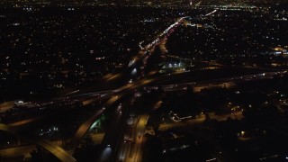 LD01_0045 - 5K aerial stock footage video light traffic on freeway interchange at night, West Los Angeles, California