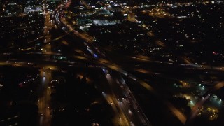 LD01_0046 - 5K aerial stock footage orbit a freeway interchange at night in West Los Angeles, California