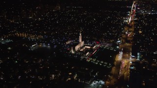 LD01_0050 - 5K aerial stock footage tilt to reveal the Los Angeles California Temple, Westwood, California, at night