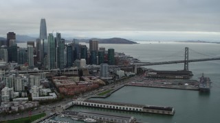 5.7K stock footage aerial video pan from Bay Bridge to reveal city's skyline, Downtown San Francisco, California Aerial Stock Footage | PP0002_000012