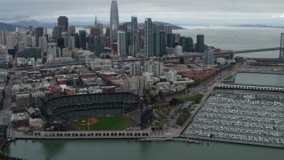 5.7K stock footage aerial video flying away from AT&T Park, with city skyline in background, Downtown San Francisco, California Aerial Stock Footage | PP0002_000017