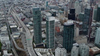 5.7K stock footage aerial video tilt from skyscrapers to bird's eye of traffic on Bay Bridge, Downtown San Francisco, California Aerial Stock Footage | PP0002_000043