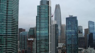 5.7K stock footage aerial video descend by skyscrapers to reveal the Bay Bridge, Downtown San Francisco, California Aerial Stock Footage | PP0002_000047